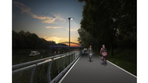 Visualisierung eines beleuchteten Radweges am Ufer eines Flusses. Auf dem Radweg begegnen sich zwei Radfahrende.