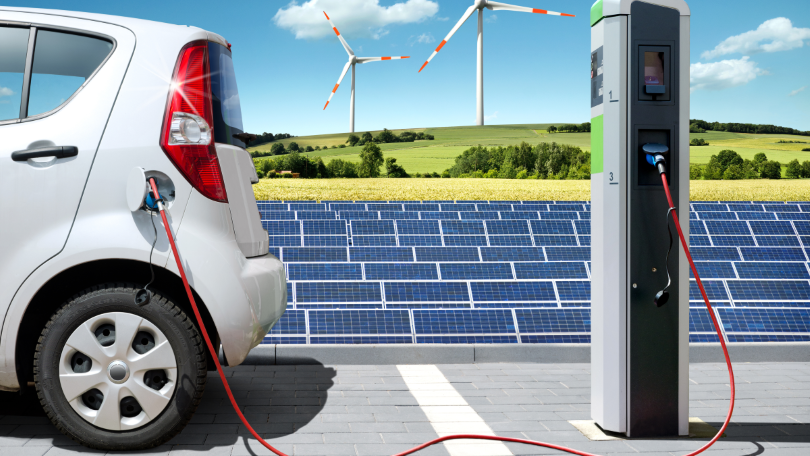 Visualisierung eines Elektroautos mit Solartankstelle und Windkraft