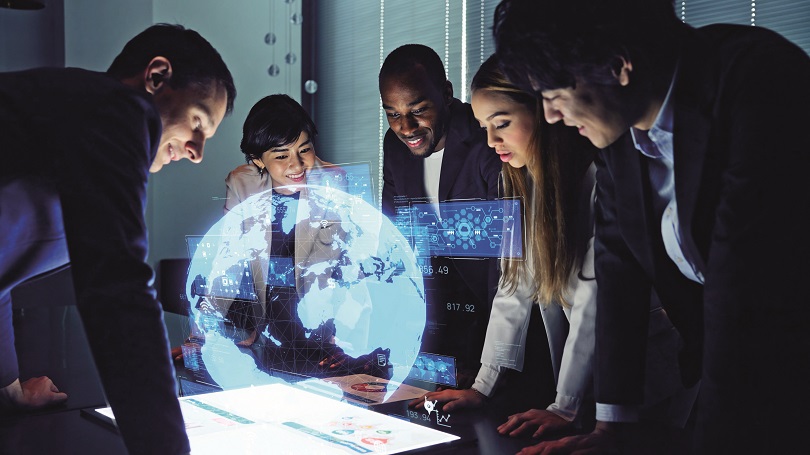 Group of people watching hologram display